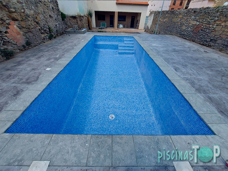Construcción de piscinas de gresite en {poblacion(construcción de piscinas de porcelánico en Pinto)}